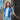 Model wearing the FC Porto 1971 - 72 Retro Football Shirt outdoors, standing against a bright background.