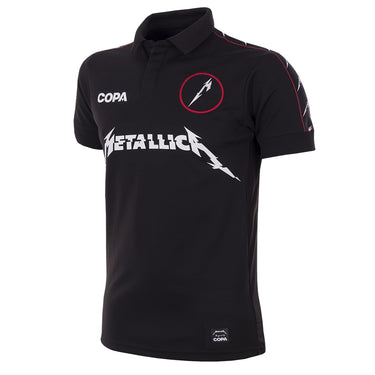 Flat-lay of the METALLICA x COPA Football Shirt, featuring a black design with embroidered badges and Metallica branding.
