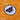 Close-up of the Brennan Heart patch on an orange football shirt with DJ-themed line art.