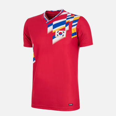 South Korea 1994 Retro Football Shirt displayed on a white background, featuring a red fabric with a vibrant multi-flag design across the upper chest and shoulder.