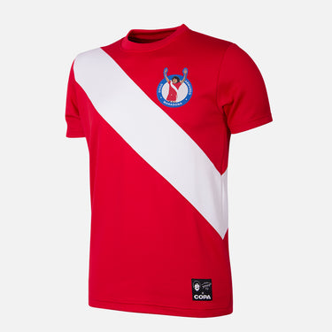 Flat lay of the retro football shirt featuring a red base with a white diagonal sash and club crest.