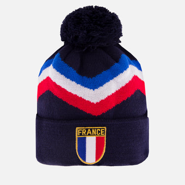 Navy blue beanie with blue, white, and red chevron pattern, pom-pom on top, and France crest on the cuff