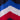 Close-up of the blue, white, and red chevron pattern on the navy blue fabric of the beanie