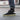 model wearing casual grey socks with a repeating pixel-style illustration of antonin panenka doing the panenka in 1976