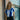 Model wearing the FC Porto 1971 - 72 Women's Retro Football Shirt, standing against a brick wall.