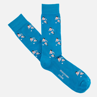 casual blue socks with a repeating pixel-style illustration of maradona