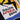 Detailed view of the emblem design, highlighting the bold typography and dynamic motion of the footballer.