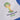 Close-up of the official 2014 World Cup emblem, featuring the golden trophy shape with green and yellow accents.