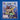 Close-up of the sticker album cover print, displaying the action-packed artwork of Italia ‘90 with players in mid-air duel.