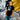 Model wearing the Maradona x COPA Argentina Football Sticker T-Shirt, standing against a graffiti wall.