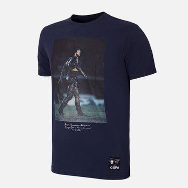 Flat lay of the Maradona x COPA Muddy Pitch T-Shirt, featuring an iconic Maradona design on a navy blue base.