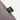 Close-up of green and yellow COPA label on side seam of polo.
