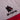 AS Roma Stripes T-Shirt Grey, Red & Yellow Logo Close-up highlighting the embroidered AS Roma wolf emblem.
