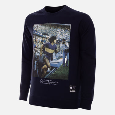 Front view of the sweater showing iconic image of Maradona with fans in La Bombonera stadium