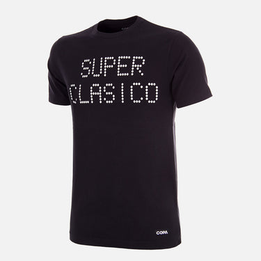 Front view of the Superclasico T-Shirt, featuring a black fabric with "SUPER CLASICO" printed in bold white dots.