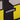 Close-up of black and yellow fabric with COPA label stitched on.