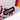 Close-up of the embroidered COPA logo stitched onto the maroon fabric.