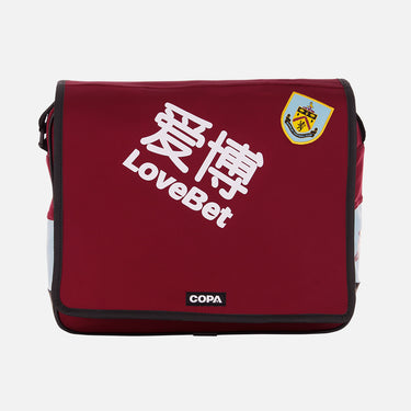 Front view of maroon Recycled Courier Bag with white Chinese characters and Burnley Crest