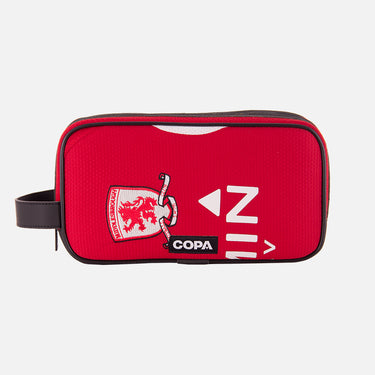 Front view of the recycled toiletry bag featuring a repurposed football shirt with a Middlesbrough badge and COPA logo