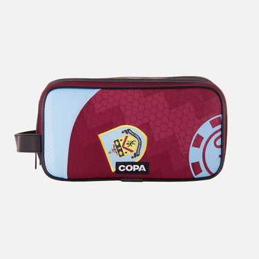 Front view of the recycled toiletry bag featuring a repurposed football shirt with a Burnley badge and COPA logo