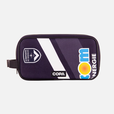 Front view of the recycled toiletry bag featuring a repurposed football shirt with a Bordeaux badge and COPA logo