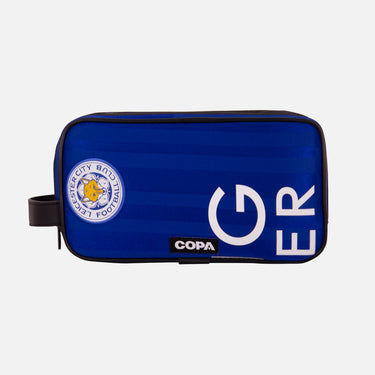 Front view of the recycled toiletry bag featuring a repurposed football shirt with a Leicester badge and COPA logo