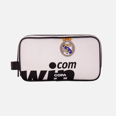 Front view of the recycled toiletry bag featuring a repurposed football shirt with a Real Madrid badge and COPA logo