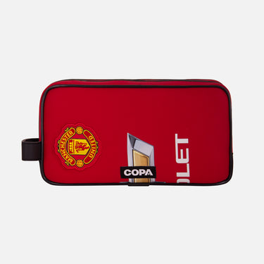 Front view of the recycled toiletry bag featuring a repurposed football shirt with a Manchester United badge and COPA logo