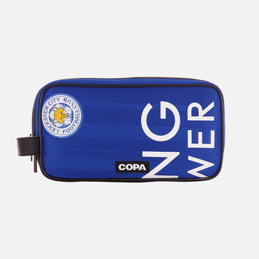 Front view of the recycled toiletry bag featuring a repurposed football shirt with a Leicester badge and COPA logo