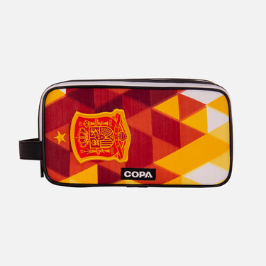 Front view of the recycled toiletry bag featuring a repurposed football shirt with a Spanish badge and COPA logo