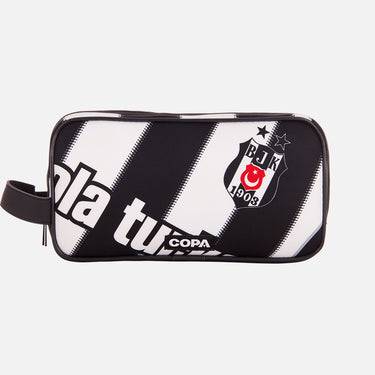 Front view of the recycled toiletry bag featuring a repurposed football shirt with a Besiktas badge and COPA logo