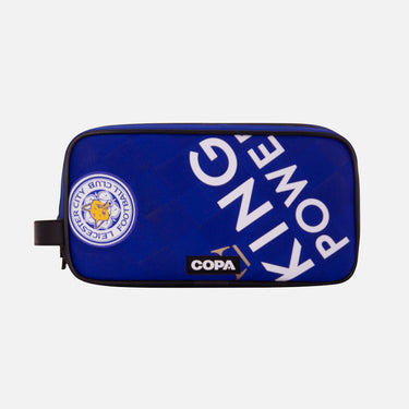 Front view of the recycled toiletry bag featuring a repurposed football shirt with a Leicester badge and COPA logo