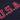 Close-up of the red 'U.S.A.' applique stitching on the navy fabric