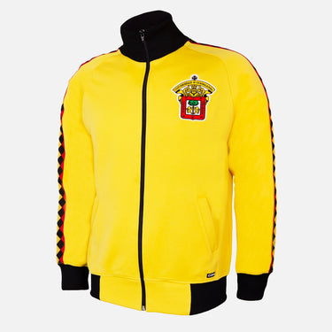 Yellow and black COPA track jacket featuring the embroidered crest of Mexican football club Leones Negros on the chest