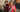 Female model wearing the FC Bayern München 1971 - 72 Retro Football Shirt and a male model wearing the FC Bayern München 1988 - 89 Retro Football Shirt