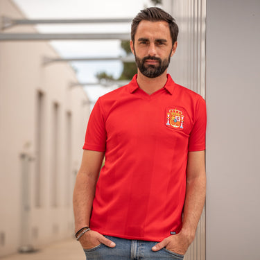 Model wearing the T-shirt, showcasing its classic fit and vintage football aesthetic.