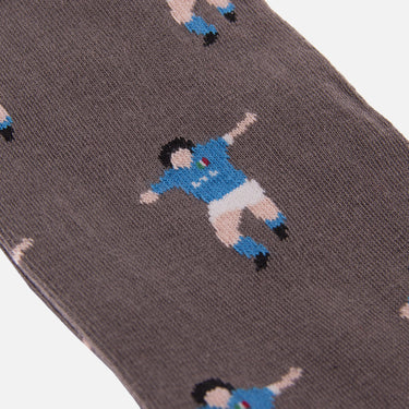 detail of casual grey socks with a repeating pixel-style illustration of maradona