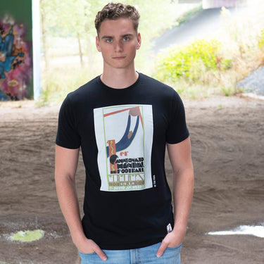 Model wearing the Uruguay 1930 World Cup Emblem T-Shirt, standing outdoors.