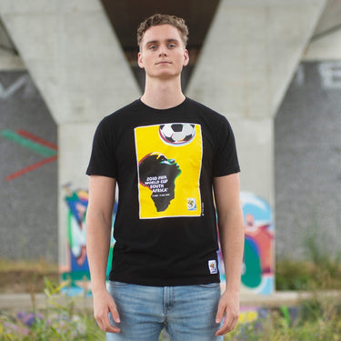 A model wearing the South Africa 2010 World Cup Poster T-Shirt in an outdoor setting.