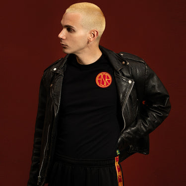 AS Roma Black Taper T-Shirt Black & Red Lifestyle worn by a model in a bold indoor setting with a leather jacket.