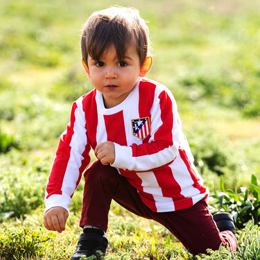 Action shot of a young child wearing the shirt while playing outdoors.