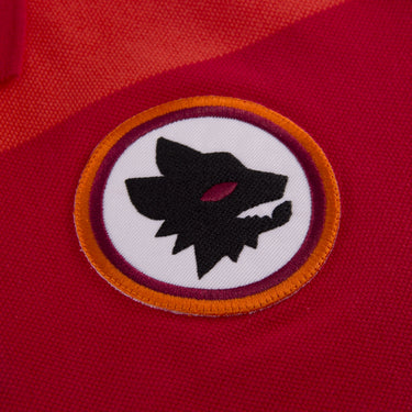 Close-up of embroidered AS Roma wolf badge on the chest
