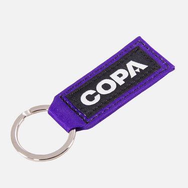 Purple fabric keychain with COPA branding and silver keyring.