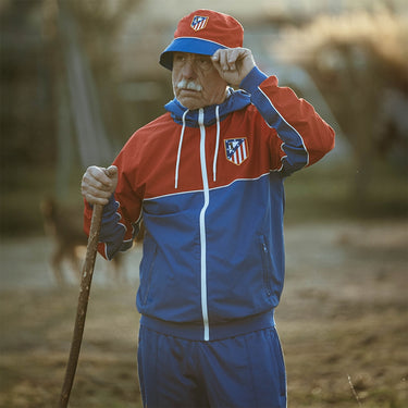 Atlético de Madrid color block windbreaker worn by model lifestyle shot
